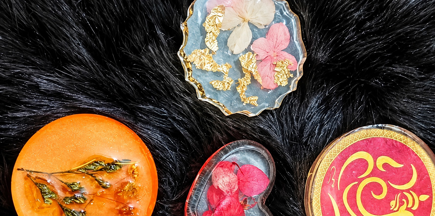 Colourful floral and devotional resin pieces shown on Santosh’s Instagram